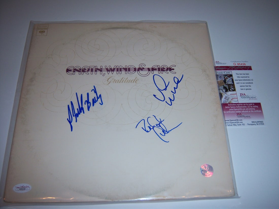 Earth Wind & Fire Gratitude Signed Vinyl Album with JSA COA: Earth Wind & Fire Gratitude Signed Vinyl Album with JSA COA Celebrate the iconic music of Earth, Wind & Fire with this pre-owned signed LP record album, featuring three signatures authenticated by JSA