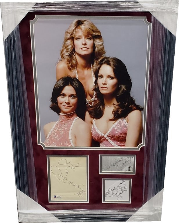 Charlie's Angels Cast Signed Cuts Framed Photo Beckett Authenticated: Charlie's Angels Cast Signed Cuts Framed Photo Beckett Authenticated This unique piece features autographed index cards from the iconic cast of Charlie's Angels, including Kate Jackson, Farrah Fawcett