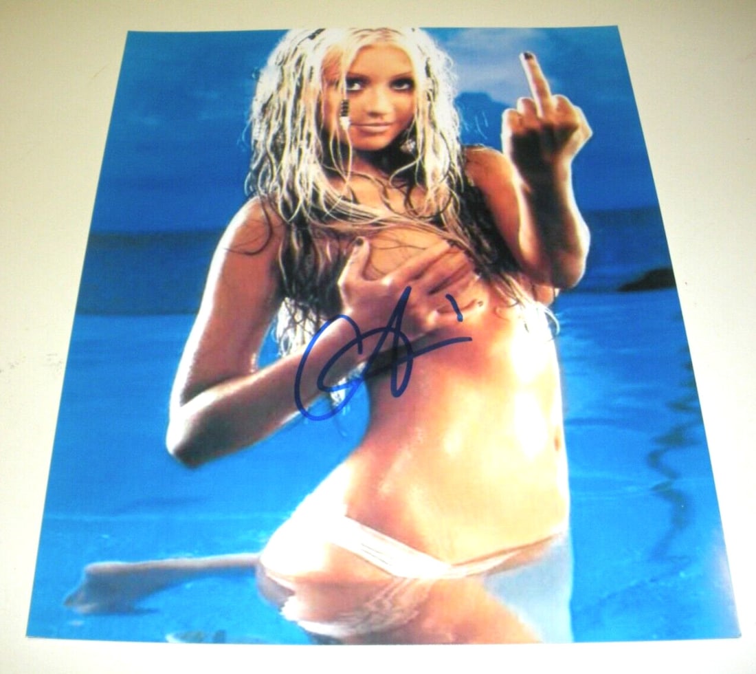 Christina Aguilera Signed 8x10 Photo Authentic Memorabilia: Christina Aguilera Signed 8x10 Photo Authentic Memorabilia This is an authentic 8x10 photograph of Christina Aguilera, the renowned singer and actress, featuring her signature. This pre-owned item sho