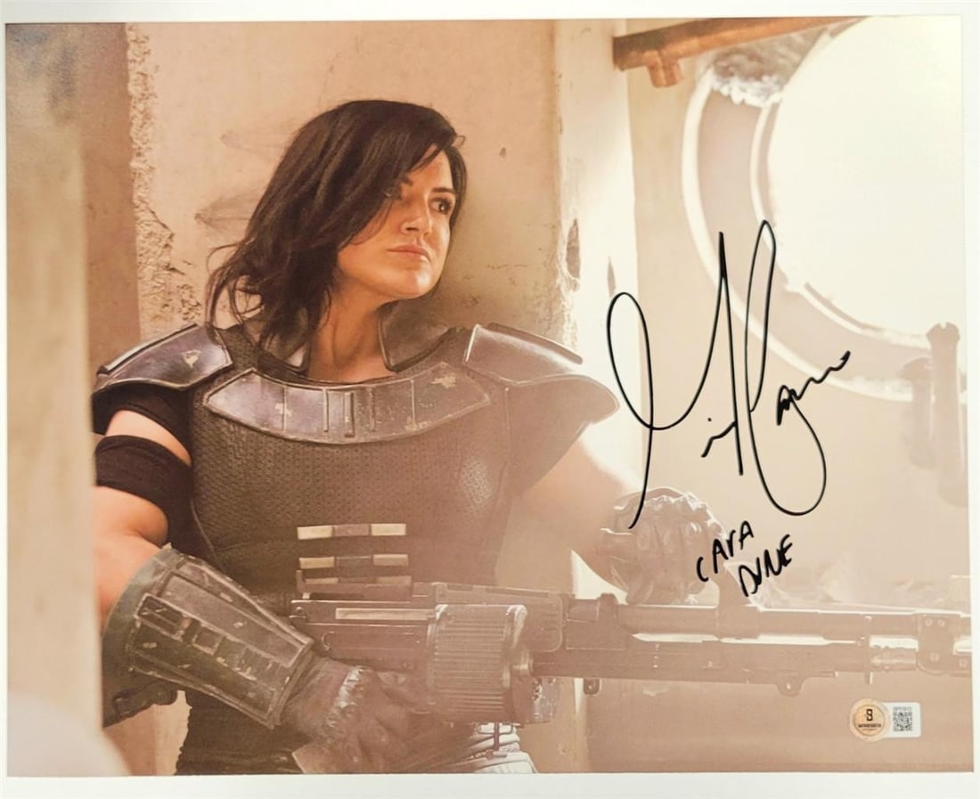 11x14 Gina Carano Autographed Cara Dune Mandalorian Photo Beckett Authenticated: 11x14 Gina Carano Autographed Cara Dune Mandalorian Photo Beckett Authenticated This is an original 11x14 photograph signed by Gina Carano as "Cara Dune" from The Mandalorian. The autograph is authent
