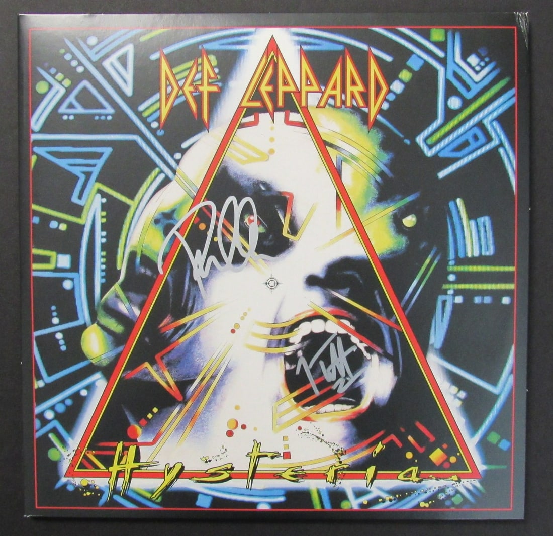 Def Leppard Hysteria Dual-Signed Album by Joe Elliott and Phil Collen JSA Authenticated: Def Leppard Hysteria Dual-Signed Album by Joe Elliott and Phil Collen JSA Authenticated This is an original, dual-signed album of 'Hysteria' by Def Leppard, featuring the signatures of Joe Elliott
