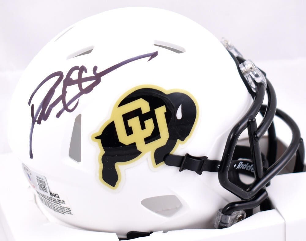 Deion Sanders Signed Colorado Buffaloes Mini Helmet Beckett Authenticated: Deion Sanders Signed Colorado Buffaloes Mini Helmet Beckett Authenticated This Colorado Buffaloes White Speed Mini Helmet features the signature of legendary football player Deion Sanders. An