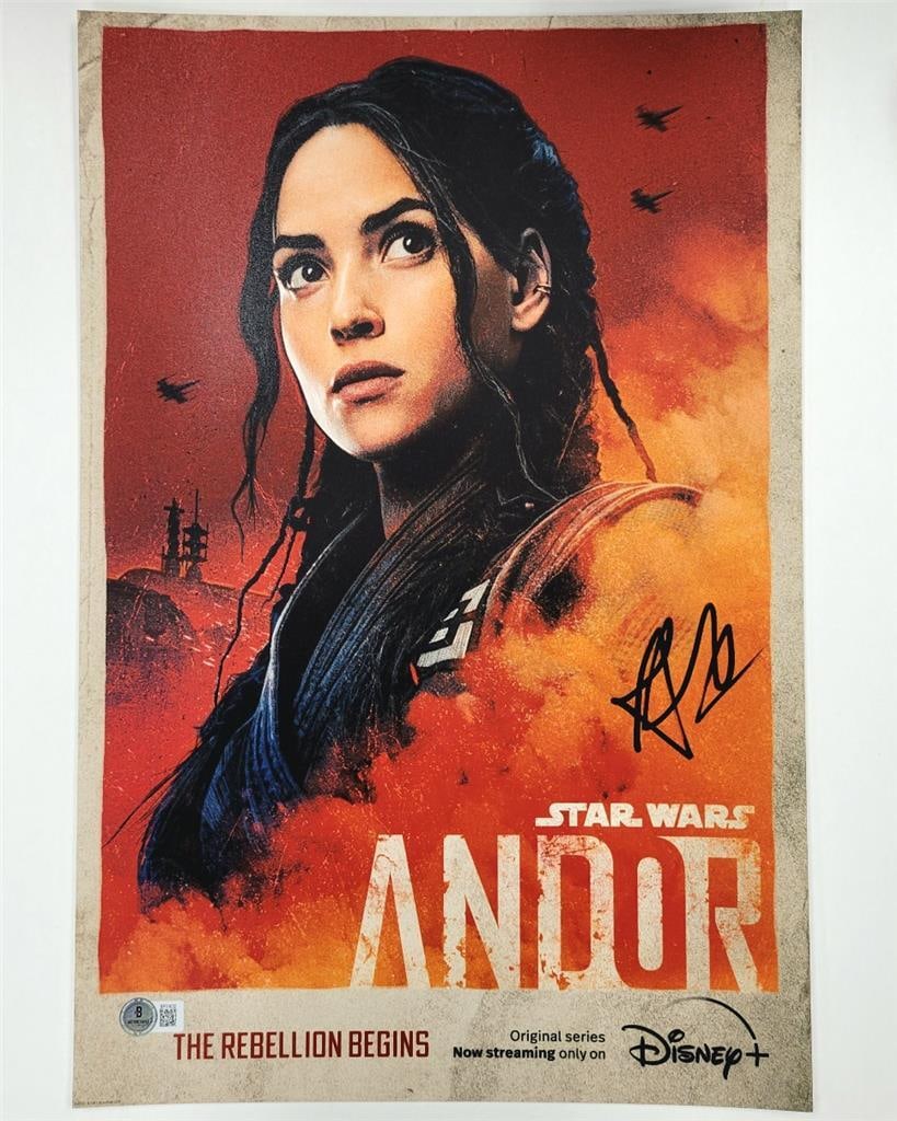 Adria Arjona autographed 12x18 Andor photo as Bix Caleen Beckett authenticated: Adria Arjona autographed 12x18 Andor photo as Bix Caleen Beckett authenticated This is an original 12x18 inch photograph from Star Wars: Andor, personally signed by Adria Arjona as Bix Caleen. The aut