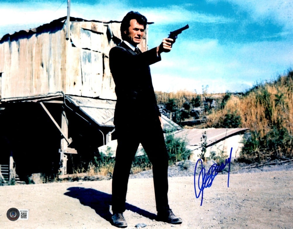 Clint Eastwood Autographed 11x14 Dirty Harry Photo Beckett Authenticated: Clint Eastwood Autographed 11x14 Dirty Harry Photo Beckett Authenticated Own a piece of cinematic history with this authentic 11" x 14" photograph of Clint Eastwood portraying the iconic character Dir
