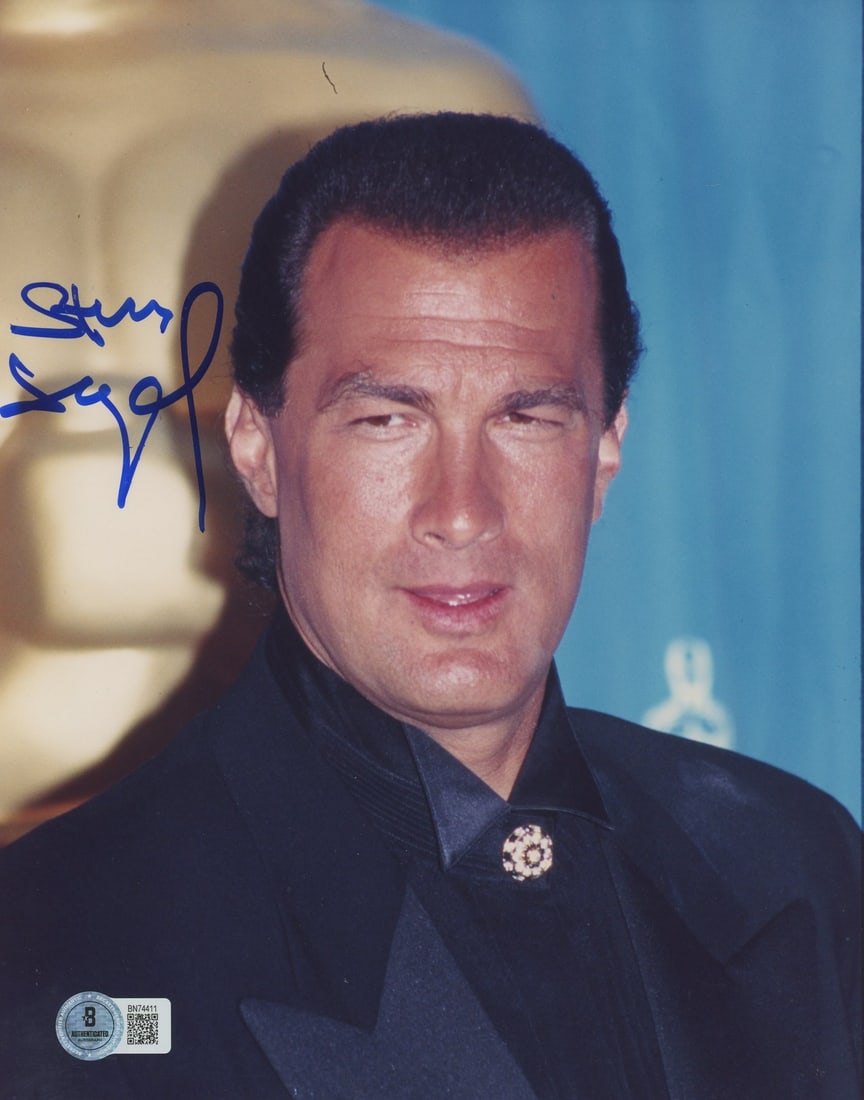 Steven Seagal Above the Law Signed 8x10 Photo Beckett Authenticated: Steven Seagal Above the Law Signed 8x10 Photo Beckett Authenticated This authentic 8x10 photograph features Steven Seagal, personally signed and certified by Beckett Authentication Services. The signa