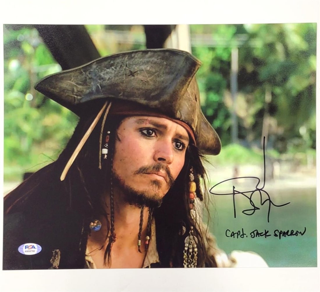 Pirates of the Caribbean 11x14 Photo Johnny Depp Autograph PSA 10: Pirates of the Caribbean 11x14 Photo Johnny Depp Autograph PSA 10 This is an original 16x20 photograph from Pirates of the Caribbean, signed by Johnny Depp as Captain Jack. The autograph is authentica