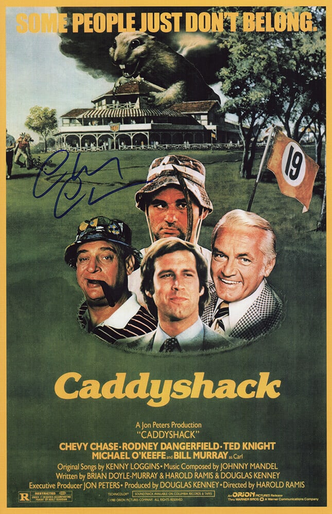 Chevy Chase Signed Caddyshack 11x17 Poster in Blue with COA: Chevy Chase Signed Caddyshack 11x17 Poster in Blue with COA This is an original 11x17 movie poster of 'Caddyshack' signed by Chevy Chase. The signature is in blue sharpie and comes with a tamper-proof
