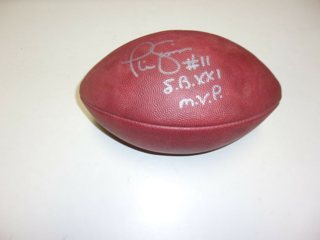 Phil Simms Signed Official Game Football SB XXI MVP with COA: Phil Simms Signed Official Game Football SB XXI MVP with COA This official game football is a collectible piece celebrating Phil Simms, the MVP of Super Bowl XXI, representing the New York Giants. It
