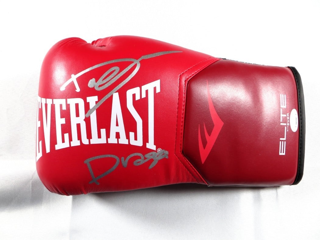 Dolph Lundgren Signed Boxing Glove Rocky IV JSA Certified: Dolph Lundgren Signed Boxing Glove Rocky IV JSA Certified This is an authentic boxing glove signed by Dolph Lundgren, famous for his role as Ivan Drago in the film Rocky IV. The autograph has been aut