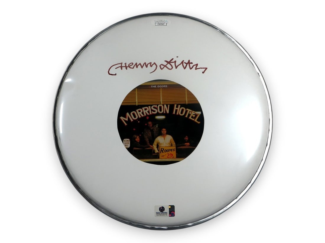 Henry Diltz Signed 10 Drumhead The Doors JSA Certified: Henry Diltz Signed 10 Drumhead The Doors JSA Certified This 10" drumhead features the authentic signature of Henry Diltz, celebrated photographer and member of The Doors. The item is original and has