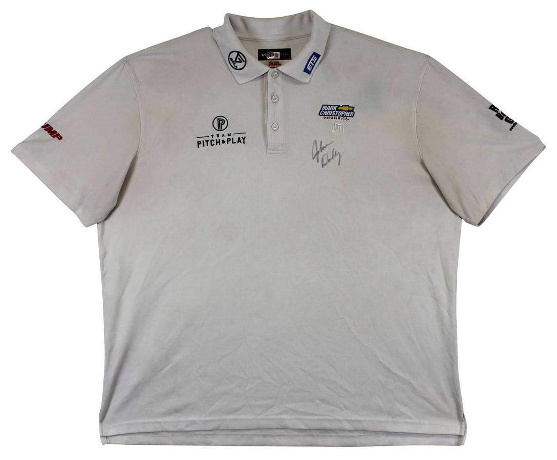 John Daly Signed Match Worn Loudmouth Polo Shirt BAS Authenticated: John Daly Signed Match Worn Loudmouth Polo Shirt BAS Authenticated This authentic match worn white Loudmouth polo shirt, featuring the Mark Christopher Team Pitch & Play design, has been personally si