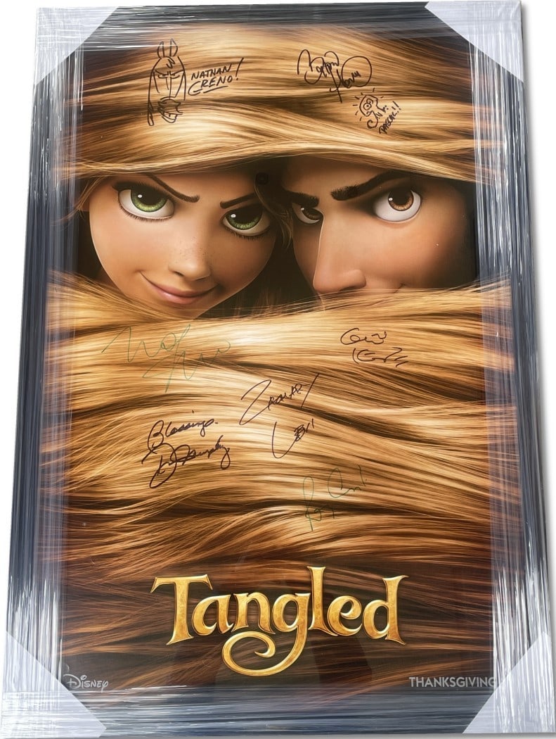 Tangled Framed Autographed Poster by Zachary Levi +6 JSA Certified: Tangled Framed Autographed Poster by Zachary Levi +6 JSA Certified This stunning framed poster features the signed autographs of the talented cast from Disney's 'Tangled'. Measuring 29x42 inches, this