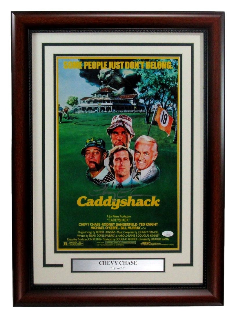 Framed 11x17 Caddyshack Poster Signed by Chevy Chase JSA Authenticated: Framed 11x17 Caddyshack Poster Signed by Chevy Chase JSA Authenticated This framed 11x17 poster from the movie "Caddyshack" features an authentic autograph by Chevy Chase. The poster is professionally