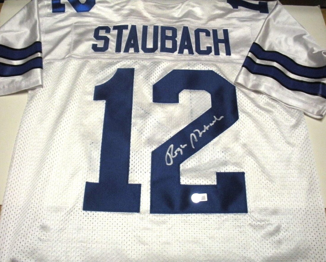 Roger Staubach Dallas Cowboys Signed Nike Jersey with Beckett COA: Roger Staubach Dallas Cowboys Signed Nike Jersey with Beckett COA This officially licensed Nike jersey features the signature of Roger Staubach, a legendary player for the Dallas Cowboys. The jersey i