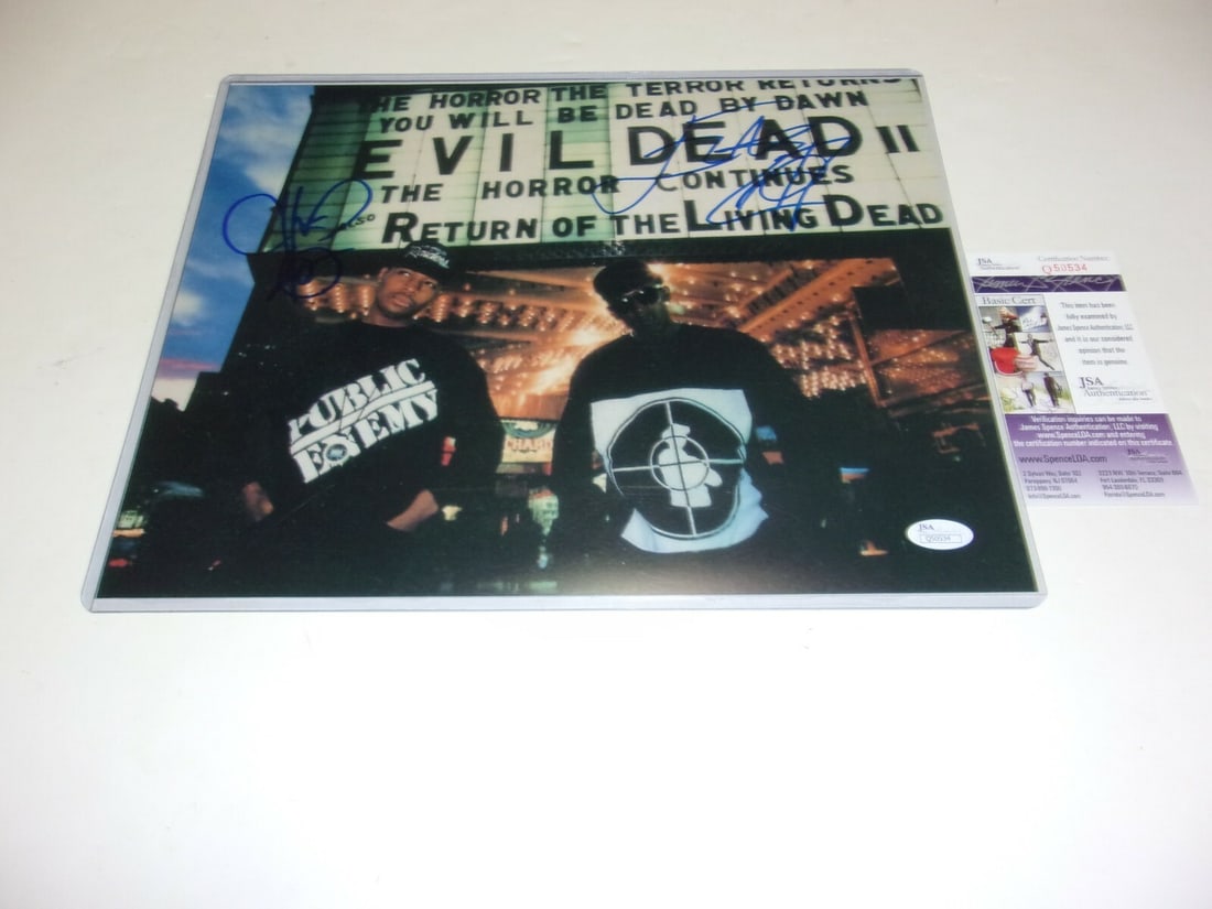 Public Enemy Signed 11x14 Photo Chuck D Flavor Flav JSA COA: Public Enemy Signed 11x14 Photo Chuck D Flavor Flav JSA COA A dynamic 11x14 photo featuring iconic rappers Chuck D and Flavor Flav of Public Enemy, both signed and authenticated with JSA/COA. This ori