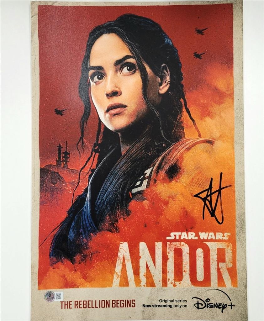 Star Wars Andor 12x18 Photo Signed by Adria Arjona Beckett Authenticated: Star Wars Andor 12x18 Photo Signed by Adria Arjona Beckett Authenticated This is an original 12x18 inch photograph from Star Wars Andor, personally signed by Adria Arjona as the character Bix. The aut