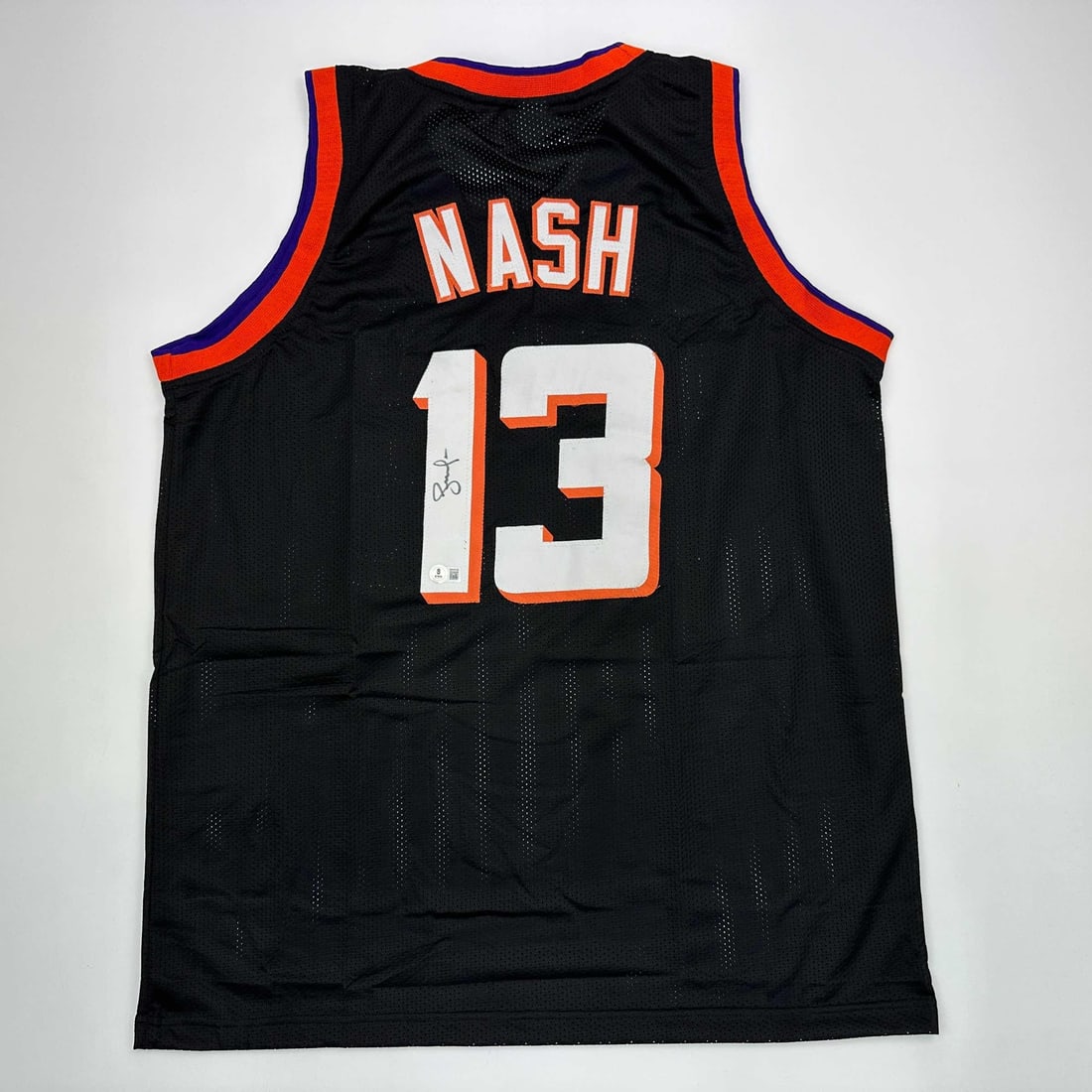 Steve Nash Autographed Phoenix Suns Black Basketball Jersey Beckett COA: Steve Nash Autographed Phoenix Suns Black Basketball Jersey Beckett COA This is an authentic autographed Steve Nash Phoenix Suns black basketball jersey, featuring the player's name and number. Authen