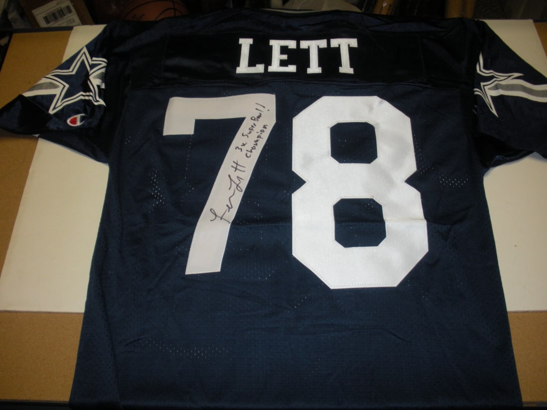 Dallas Cowboys Leon Lett Autographed Official Champion Jersey With COA: Dallas Cowboys Leon Lett Autographed Official Champion Jersey With COA This is an official licensed Dallas Cowboys Champion jersey signed by Leon Lett. The jersey comes with a Certificate of Authentic