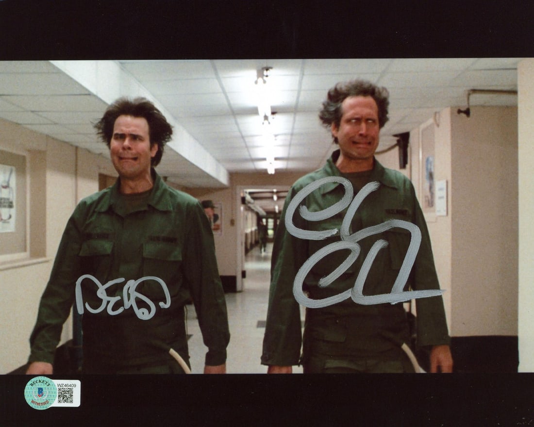 Autographed 8x10 Spies Like Us Hallway Photo Beckett Witness Chase and Aykroyd: Autographed 8x10 Spies Like Us Hallway Photo Beckett Witness Chase and Aykroyd This 8x10 photograph from the film "Spies Like Us" is personally signed by Chevy Chase and Dan Aykroyd. The autographs ha