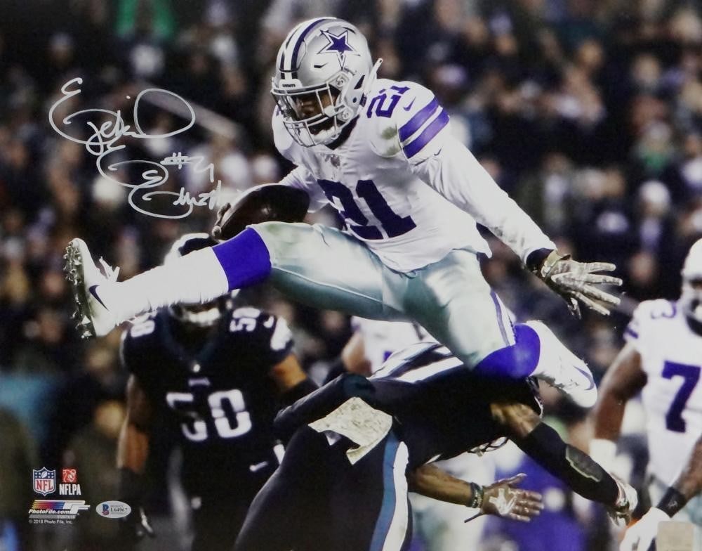 Ezekiel Elliott Autographed Cowboys 16x20 Photo Jumping Beckett Authenticated: Ezekiel Elliott Autographed Cowboys 16x20 Photo Jumping Beckett Authenticated Capture the dynamic energy of Ezekiel Elliott with this signed 16x20 photograph featuring him in a jumping side view while