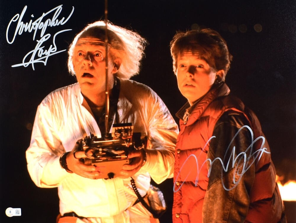 Back to the Future 16x20 Photo Signed by Christopher Lloyd and Michael J Fox Beckett: Back to the Future 16x20 Photo Signed by Christopher Lloyd and Michael J Fox Beckett This 16x20 photograph from the movie Back to the Future features authentic signatures from Christopher Lloyd and Mi