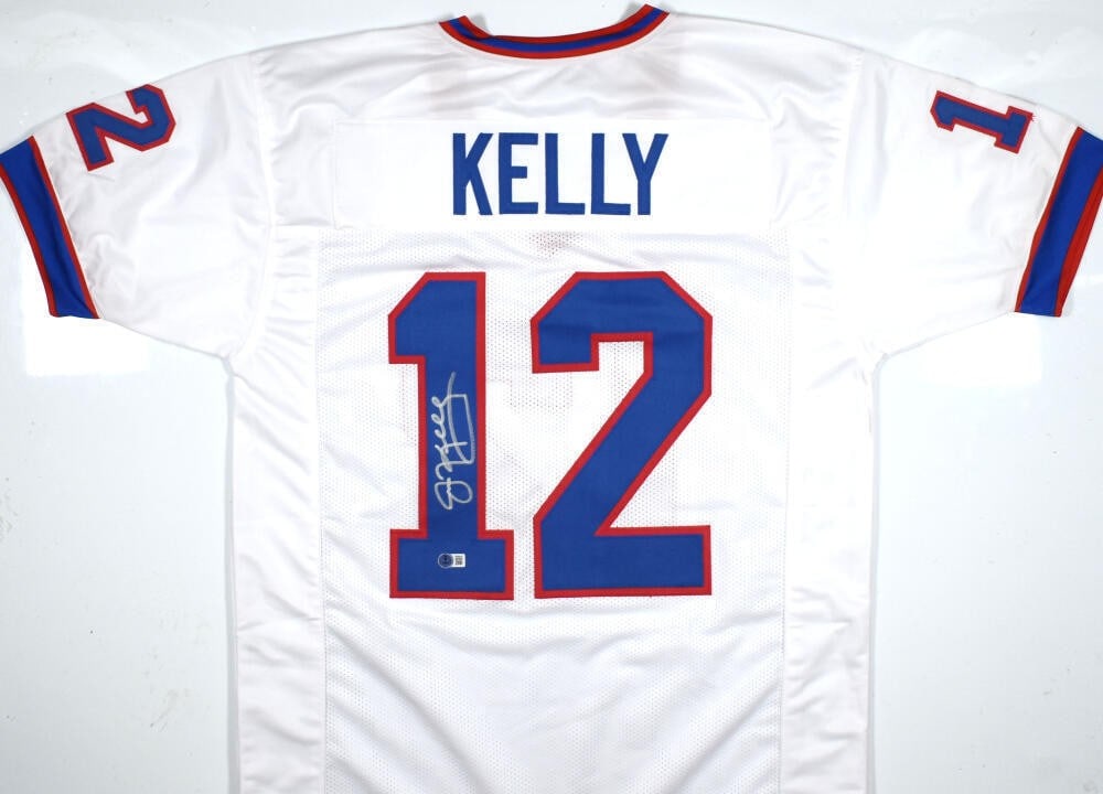 Jim Kelly Signed Buffalo Bills Pro Style Jersey Beckett Authenticated: Jim Kelly Signed Buffalo Bills Pro Style Jersey Beckett Authenticated This is an original autographed white pro-style jersey of Jim Kelly, a legendary player for the Buffalo Bills. The jersey features