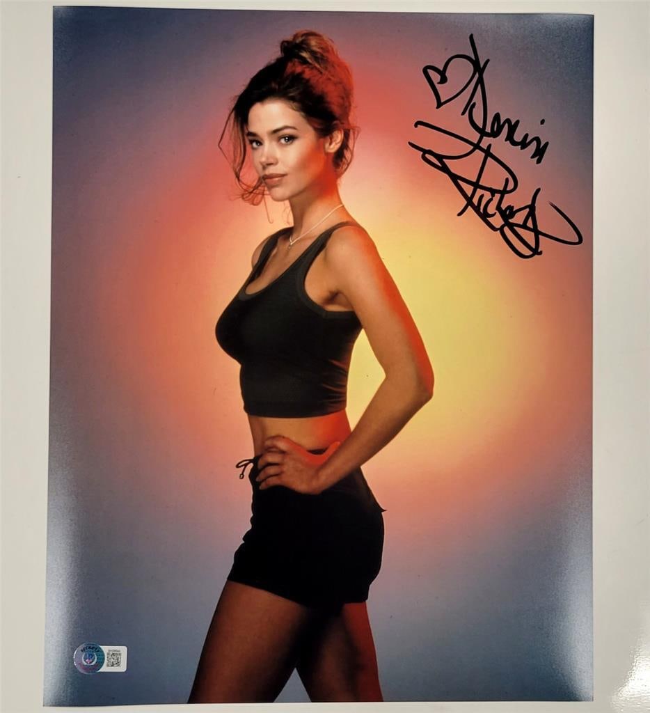 Denise Richards Autographed 11x14 Photo Beckett Authentic: Denise Richards Autographed 11x14 Photo Beckett Authentic This is an original 11x14 photograph featuring Denise Richards, known for her work as a model and actress. The photo showcases her signature,