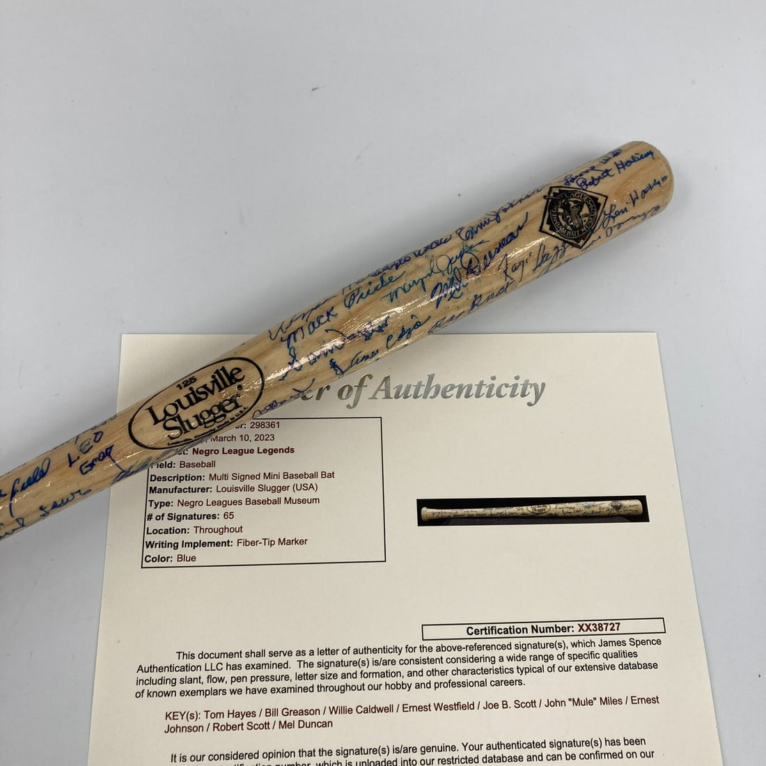 Negro League Legends Mini Baseball Bat 65 Signatures JSA COA: Negro League Legends Mini Baseball Bat 65 Signatures JSA COA This Louisville Slugger mini baseball bat is a remarkable piece of sports memorabilia, featuring 65 autographs from legendary Negro League