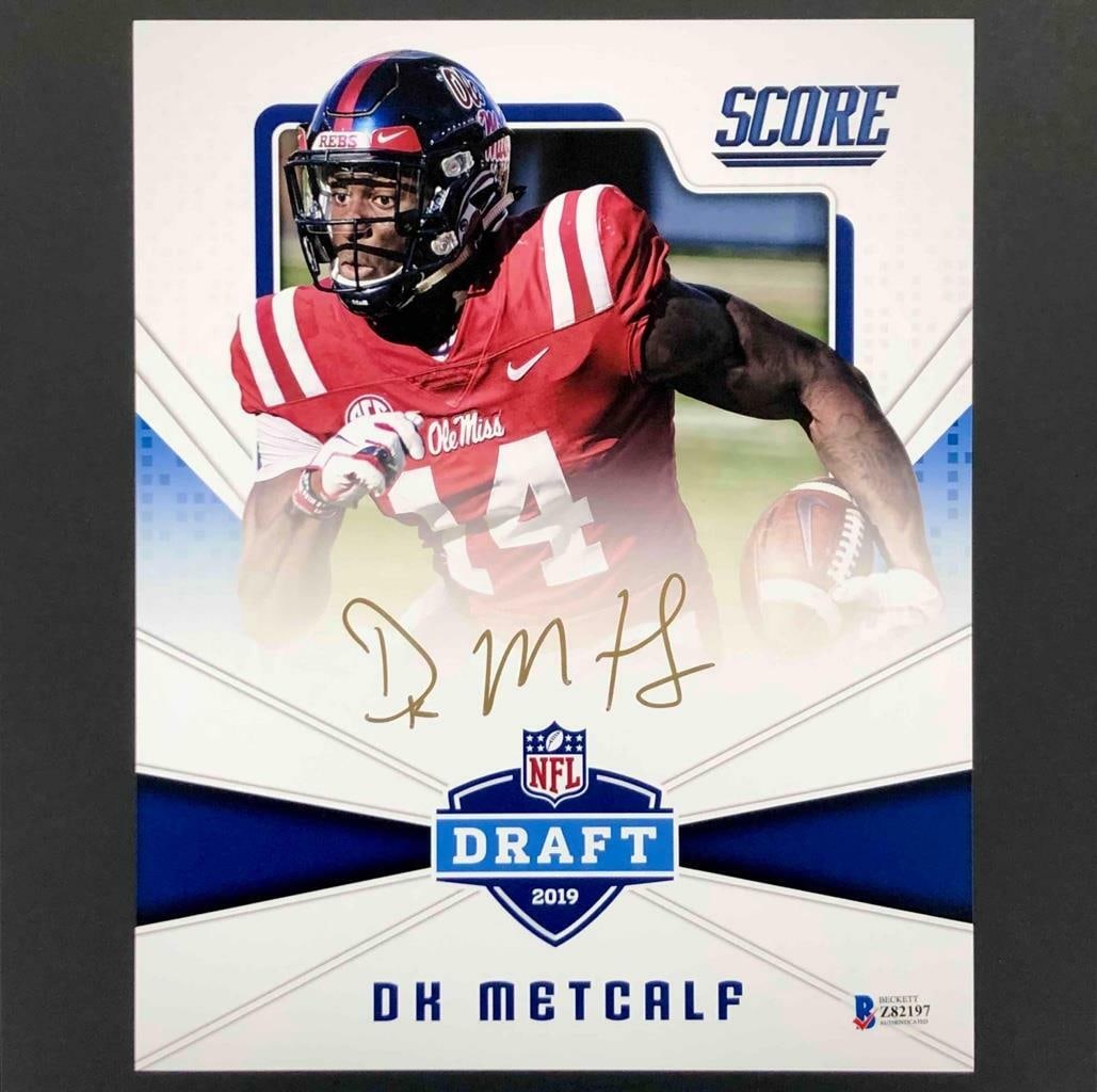 DK Metcalf Signed 2019 Panini Score 8x10 Photo BAS COA Seattle Seahawks: DK Metcalf Signed 2019 Panini Score 8x10 Photo BAS COA Seattle Seahawks This striking 8x10 photo features DK Metcalf, the talented wide receiver for the Seattle Seahawks, showcasing his electrifying p