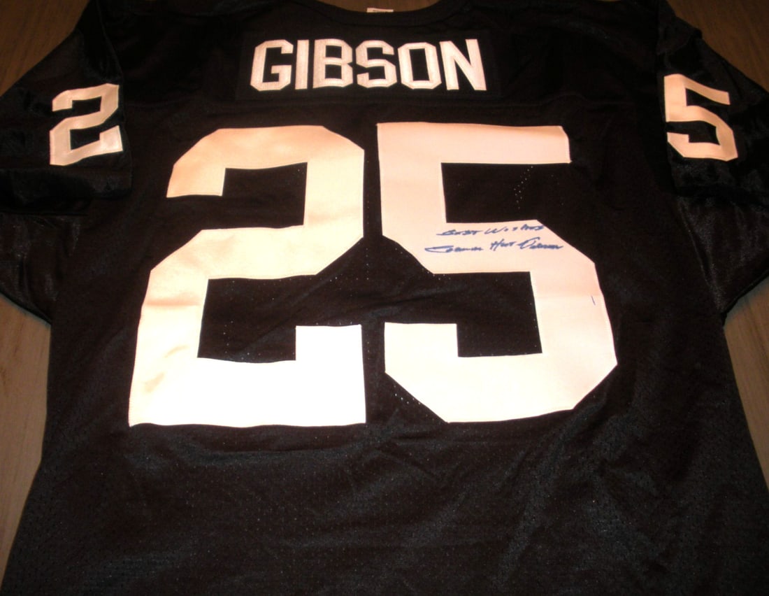 Signed Oakland Raiders Wilson Jersey with COA by Claude Gibson: Signed Oakland Raiders Wilson Jersey with COA by Claude Gibson This is an official licensed Wilson jersey signed by Claude Gibson of the Oakland Raiders. The jersey is an original item from the NFL an