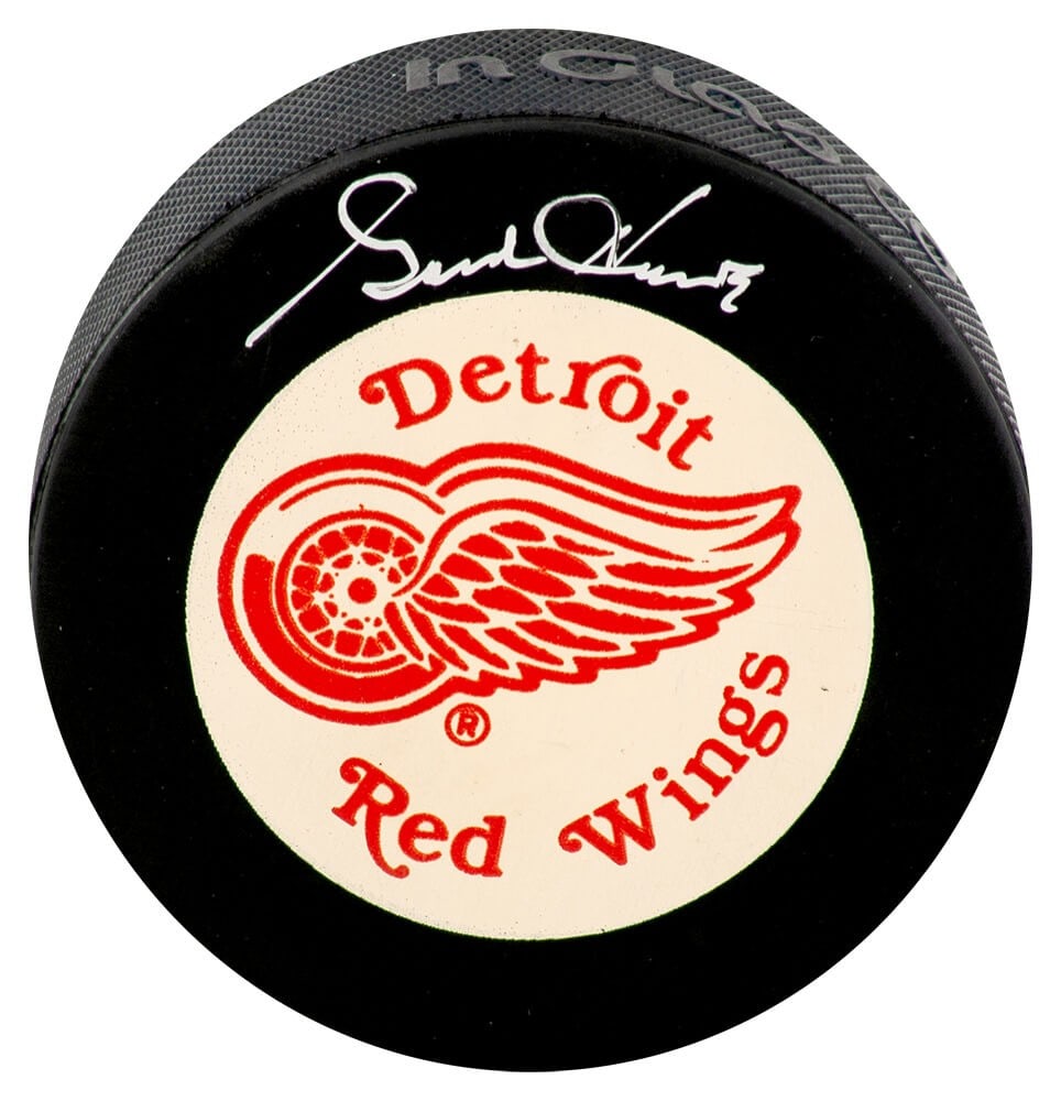 Detroit Red Wings Hockey Puck Signed by Gordie Howe JSA COA White Background: Detroit Red Wings Hockey Puck Signed by Gordie Howe JSA COA White Background This hockey puck features the large Detroit Red Wings logo on a white background and is hand-signed by Gordie Howe. The ite