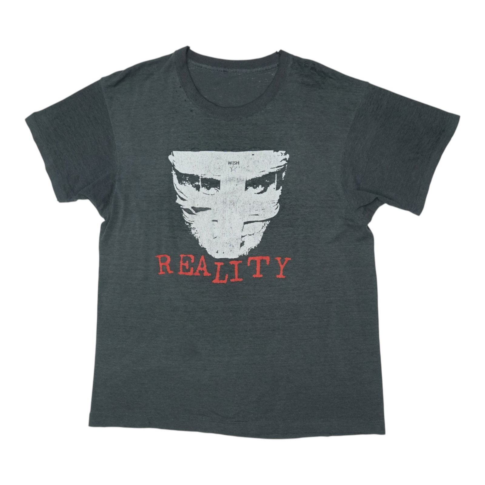 Vintage 1980s Tackhead Reality Hard Left Black Poly Cotton Graphic Tee: Vintage 1980s Tackhead Reality Hard Left Black Poly Cotton Graphic Tee This is an original vintage Tackhead Reality Hard Left shirt from the 1980s. Featuring both front and back graphics, the shirt is