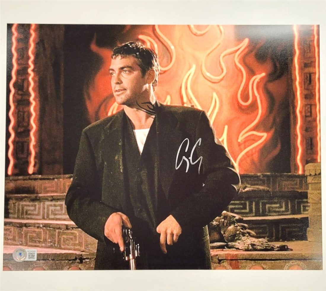 George Clooney Autographed From Dusk Til Dawn 11x14 Photo Beckett Authenticated: George Clooney Autographed From Dusk Til Dawn 11x14 Photo Beckett Authenticated This is an original 11x14 photograph from the movie 'From Dusk Til Dawn,' featuring a signature from George Clooney. The