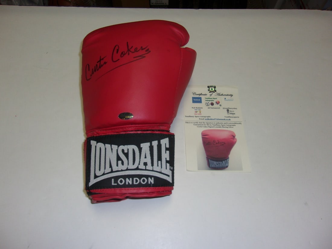 Curtis Cokes Signed Boxing Glove with COA: Curtis Cokes Signed Boxing Glove with COA This is an original boxing glove signed by Curtis Cokes, a renowned boxing champion. The glove comes with a Certificate of Authenticity (COA), ensuring its