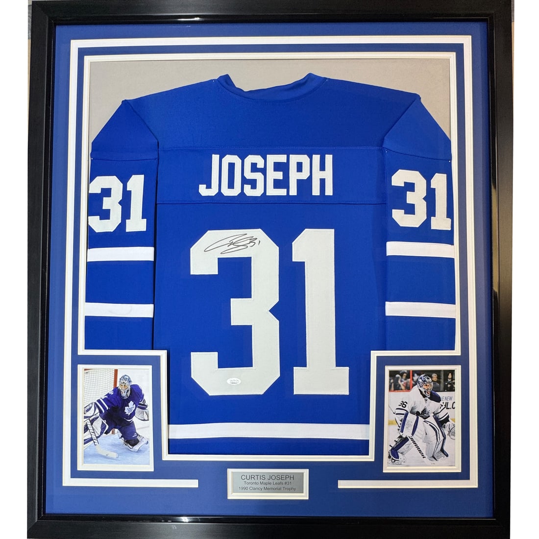 Framed Curtis Joseph Autographed NHL Jersey with JSA COA: Framed Curtis Joseph Autographed NHL Jersey with JSA COA Showcase your love for hockey with this professionally framed autographed Curtis Joseph Toronto Maple Leafs jersey. Measuring 35 inches by 39 i