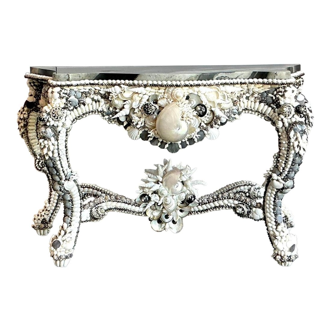Shell Encrusted Console Table with Marble Top in Coastal Rococo Style: Shell Encrusted Console Table with Marble Top in Coastal Rococo Style This vintage console table is a striking example of "Coquillage" art, featuring an ornate serpentine frame hand-encrusted with nat