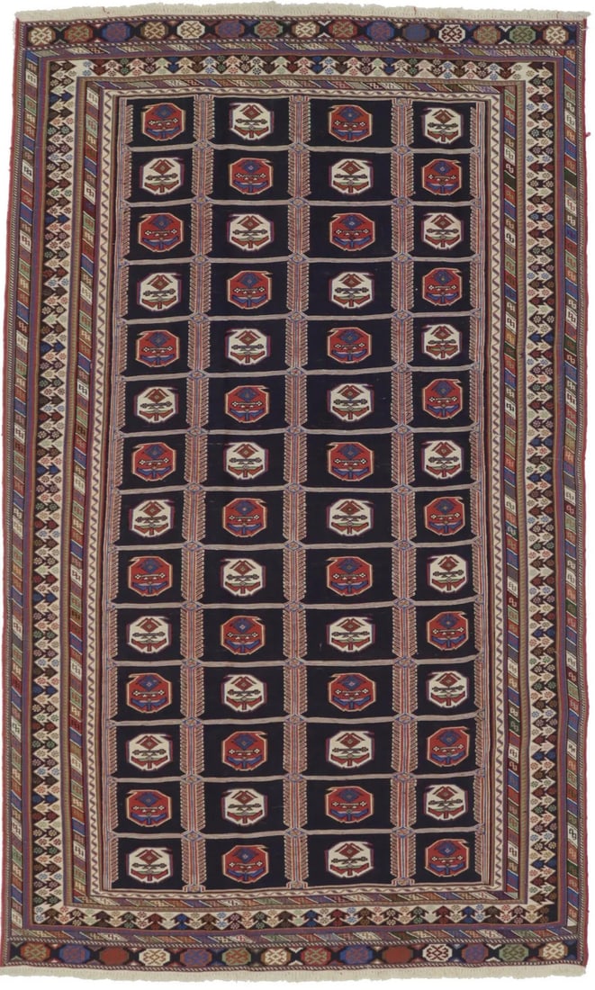 Plum Tribal Geometric Hand-Woven Wool Area Rug 4'4 x 7'5: Plum Tribal Geometric Hand-Woven Wool Area Rug 4'4 x 7'5 This hand-woven Sumak wool rug features a striking tribal geometric pattern in shades of plum, rust, cream, green, and blue. Crafted using a kn