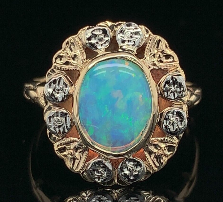 Vintage 10k Multi-Tone Gold 1.05ct Australian Opal Ring with Floral Design: Vintage 10k Multi-Tone Gold 1.05ct Australian Opal Ring with Floral Design This exquisite vintage ring showcases a beautiful 1.05 carat genuine natural Australian opal, featuring a captivating array o