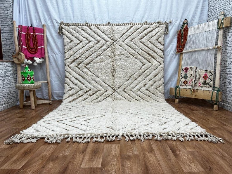 Handwoven Elegant White Engraved Rug 100% Wool Morocco 10 x 5 Feet: Handwoven Elegant White Engraved Rug 100% Wool Morocco 10 x 5 Feet Experience the luxury of this Soft Elegant White Engraved Rug, handwoven by skilled Berber women in the Atlas Mountains of Morocco. C
