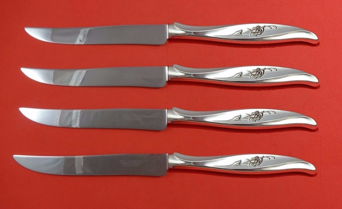 International Sterling Silver Rose Ballet Texas-Sized Steak Knife Set 4-Piece: International Sterling Silver Rose Ballet Texas-Sized Steak Knife Set 4-Piece Experience the elegance of dining with the Rose Ballet Steak Knife Set by International. This impressive four-piece set fe
