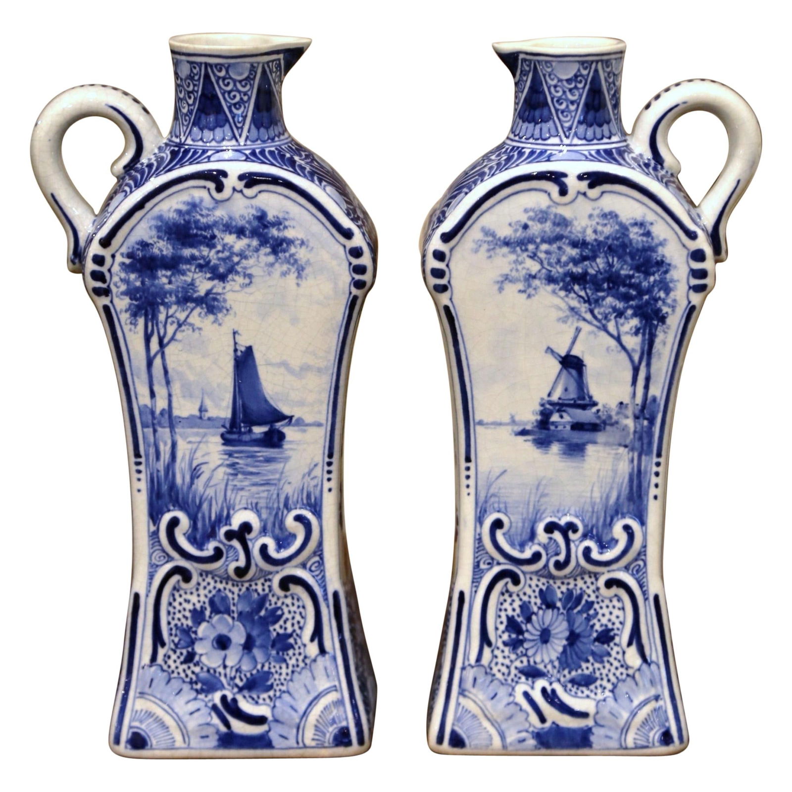 Set of 2 Antique Dutch Delft Hand-Painted Oil or Vinegar Bottles: Set of 2 Antique Dutch Delft Hand-Painted Oil or Vinegar Bottles This exquisite pair of early 20th century Dutch painted faience Delft oil or vinegar bottles adds a touch of elegance to any kitchen or