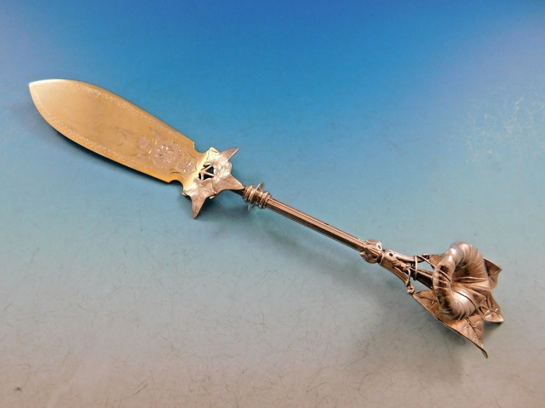 Gorham Morning Glory Sterling Silver Master Butter Knife 8.5": Gorham Morning Glory Sterling Silver Master Butter Knife 8.5" This exquisite serving piece features a master butter knife from the renowned Gorham brand, crafted from high-quality sterling silver. The