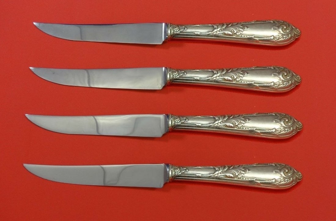 Reed & Barton Romaine Sterling Silver Steak Knife Set 4pc 8.5": Reed & Barton Romaine Sterling Silver Steak Knife Set 4pc 8.5" Elevate your dining experience with this exquisite 4-piece steak knife set from Reed & Barton, featuring the elegant Romaine pattern. Cra