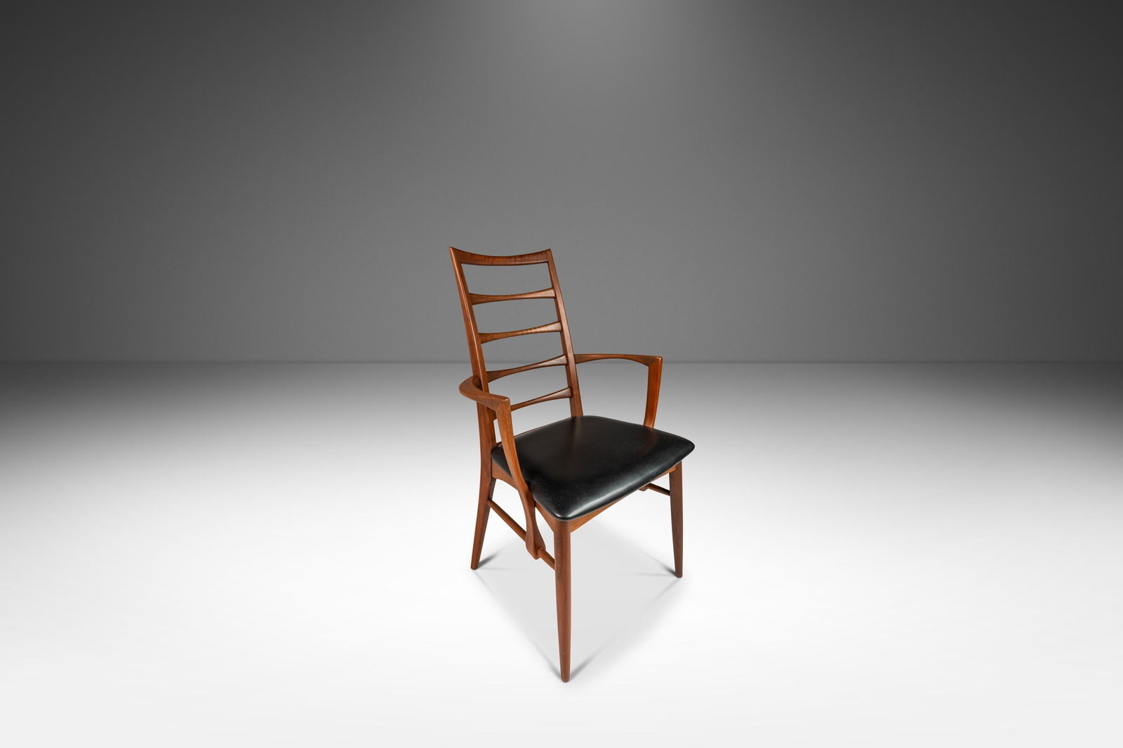 Danish Modern Lis Chair by Niels Koefoed in Walnut & Vinyl 1960s: Danish Modern Lis Chair by Niels Koefoed in Walnut & Vinyl 1960s Presenting a stunning Danish Modern Captain's Arm "Lis" Chair crafted from solid walnut and featuring original vinyl upholstery, design