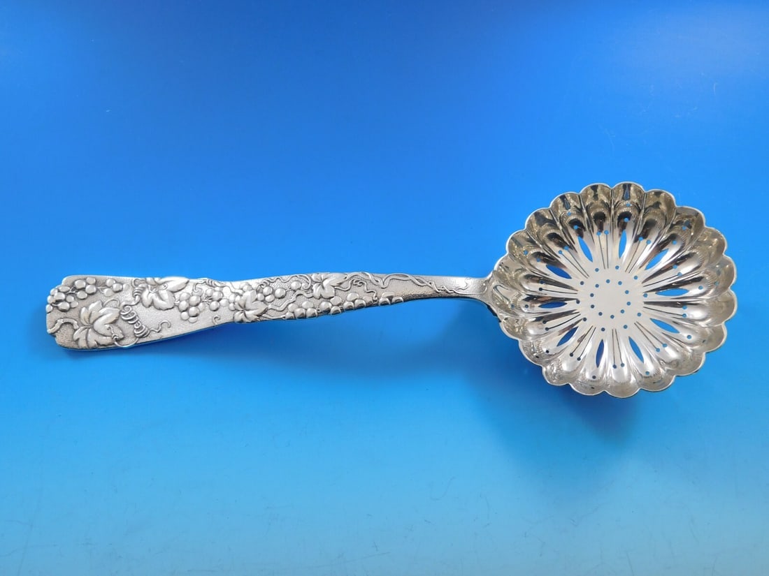 Tiffany & Co Vine Sterling Silver Pea Spoon 8 3/4 inches Grapes Motif: Tiffany & Co Vine Sterling Silver Pea Spoon 8 3/4 inches Grapes Motif This exquisite serving spoon from Tiffany & Co. features a charming grapes motif within the Vine pattern. Crafted from
