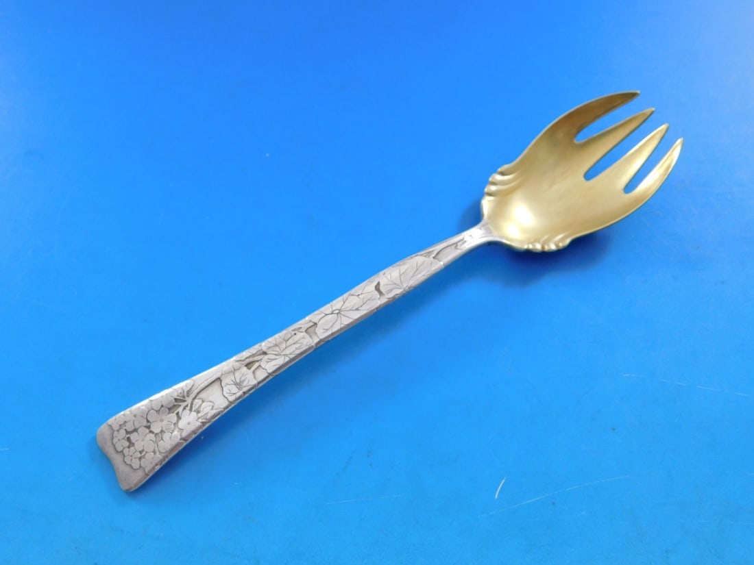 Tiffany Sterling Silver Ice Cream Fork Geranium Flowers 5.75": Tiffany Sterling Silver Ice Cream Fork Geranium Flowers 5.75" Indulge in a touch of elegance with this exquisite Tiffany & Co. ice cream fork, crafted from high-quality sterling silver. The fork featu