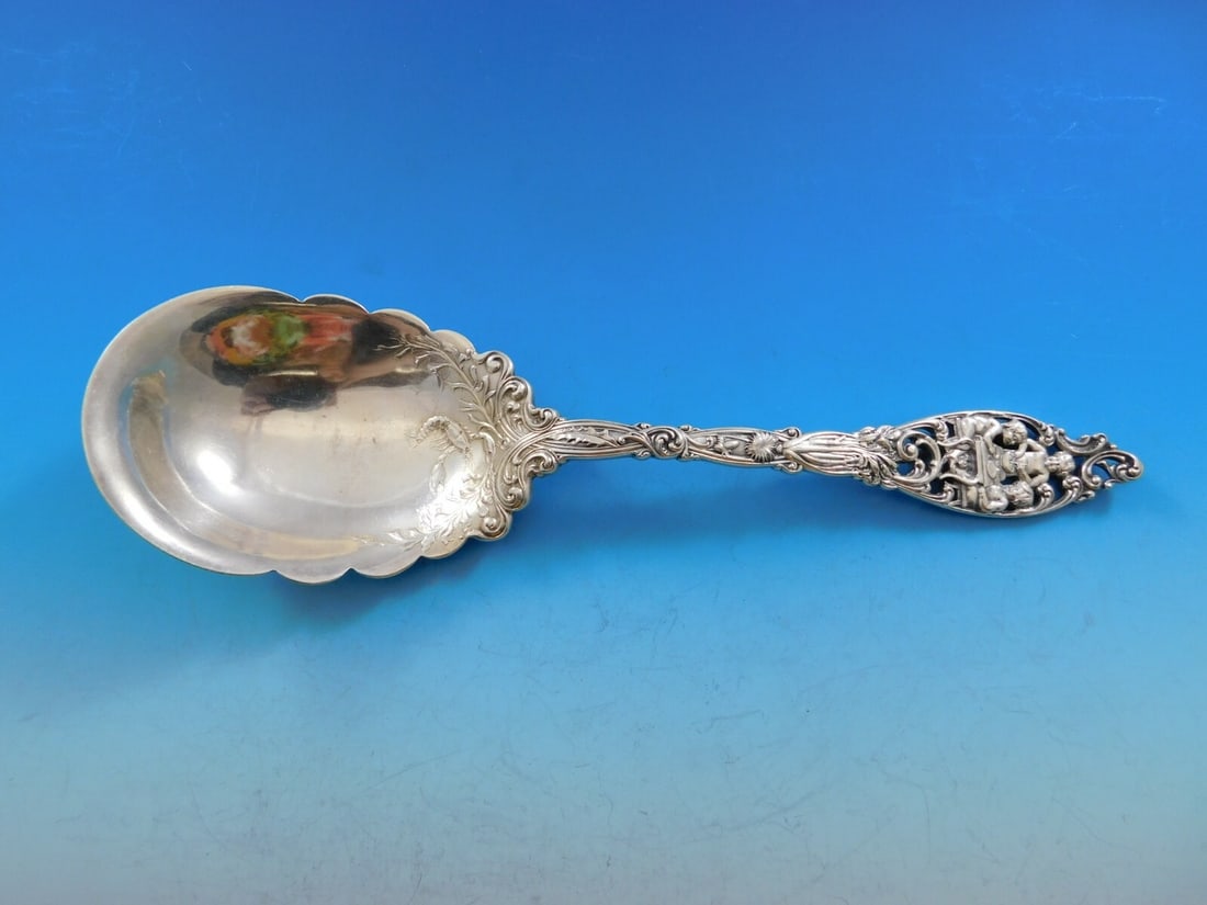 Dominick & Haff Labors of Cupid Sterling Silver Berry Spoon 9 3/8": Dominick & Haff Labors of Cupid Sterling Silver Berry Spoon 9 3/8" This exquisite berry serving spoon features the elegant Labors of Cupid pattern by Dominick & Haff. Crafted from high-quality