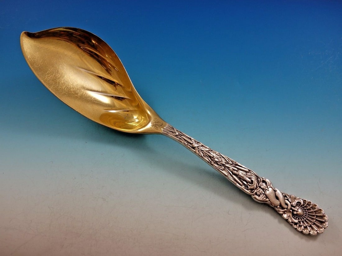 Tiffany & Co Dolphin Sterling Silver Ice Cream Server Gold Wash 12": Tiffany & Co Dolphin Sterling Silver Ice Cream Server Gold Wash 12" This exquisite 12" ice cream server features the iconic Dolphin pattern by Tiffany & Co., crafted from sterling silver and enhanced