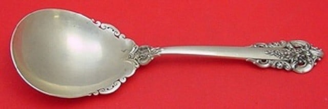Wallace Grande Baroque Sterling Silver Berry Spoon 9 1/4": Wallace Grande Baroque Sterling Silver Berry Spoon 9 1/4" This exquisite berry spoon is crafted in all sterling silver and features the elegant Grande Baroque pattern by Wallace. Measuring 9 1/4 inche