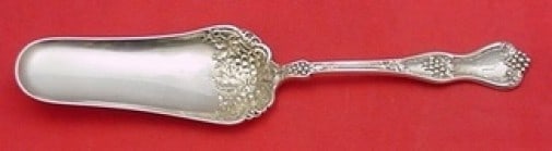 Dominick & Haff Grape Sterling Silver Jelly Cake Server 7 3/4 in: Dominick & Haff Grape Sterling Silver Jelly Cake Server 7 3/4 in This stunning jelly cake server is crafted from sterling silver and features the elegant Grape pattern by Dominick & Haff. Measuring 7